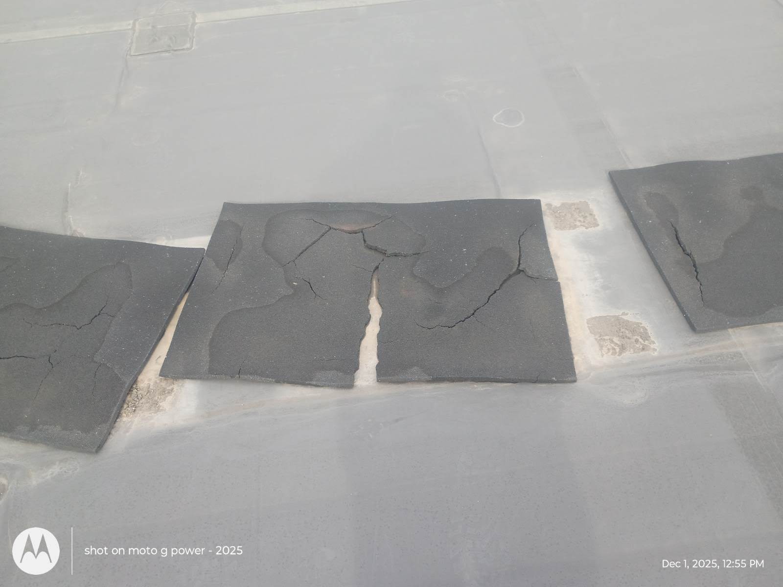 Roofing repair work in progress on a residential property